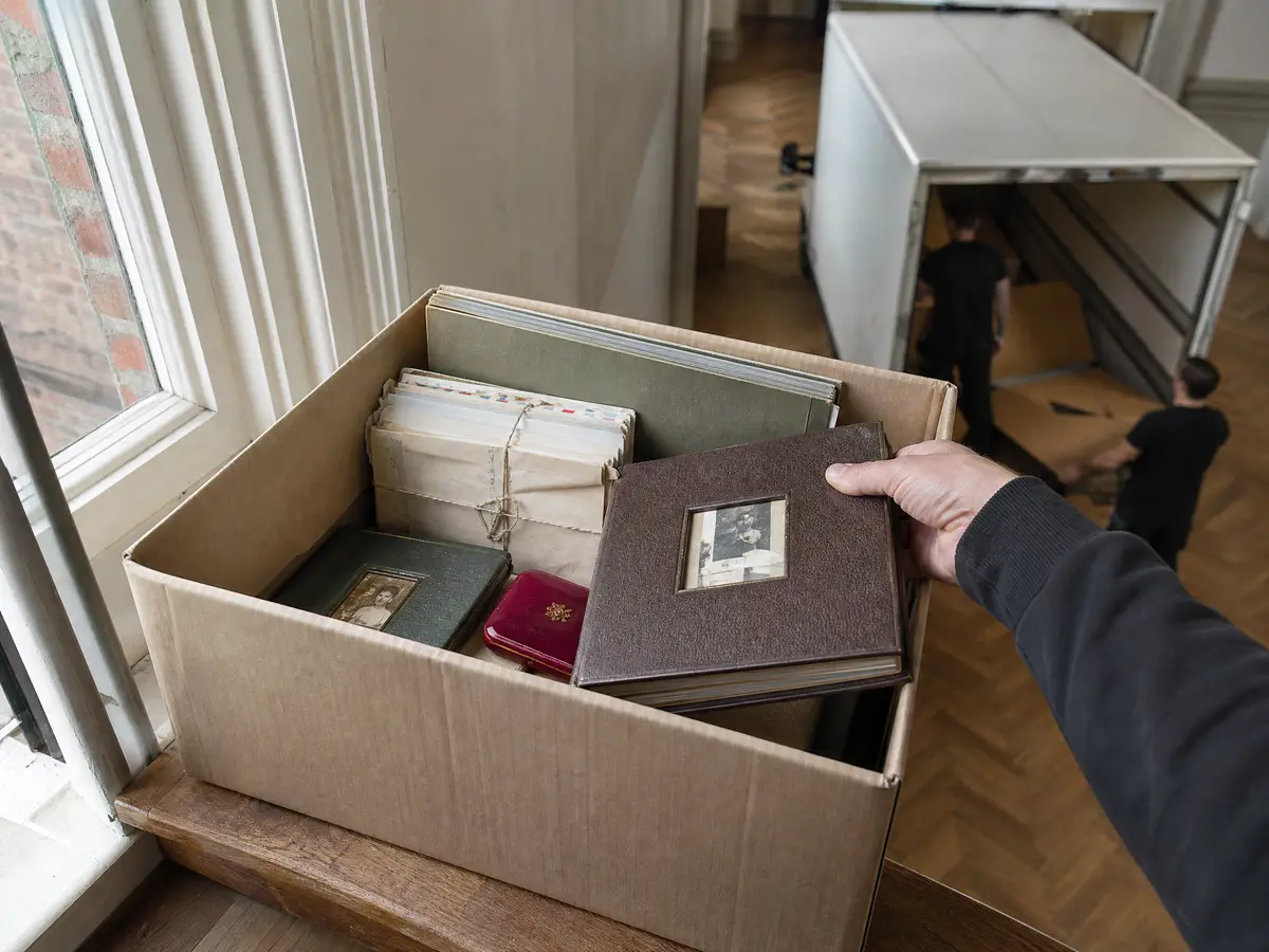 Box of photo albums, letters and documents set aside for the family during a clearance in Antwerpen
